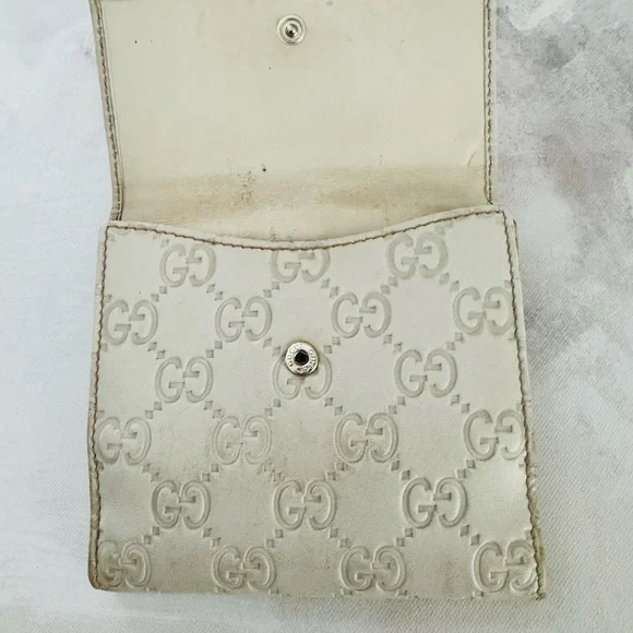 Gucci Guccissima Ivory Leather GG Logo BiFold Wallet, Gold Piston Closure